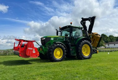 Tractor and Flail mowers attached to front and rear used for maintenance